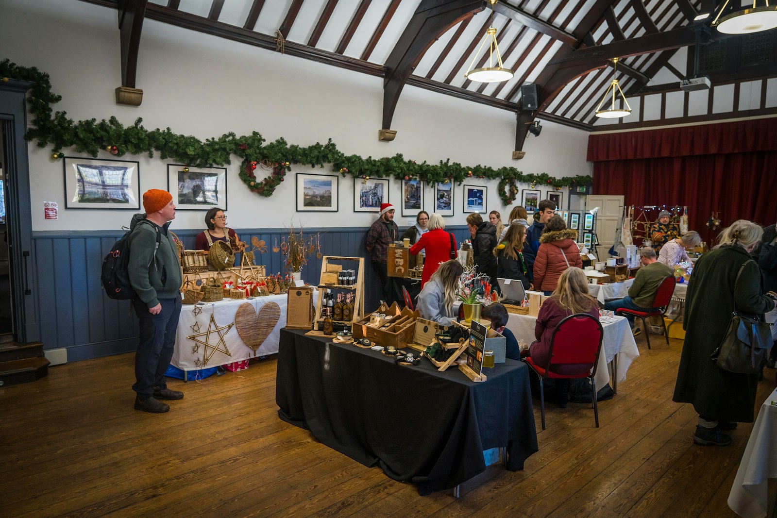 Guests browsing auction items displayed on tables at a community fundraising event